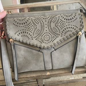 2/$15. Gray laser cut detail purse